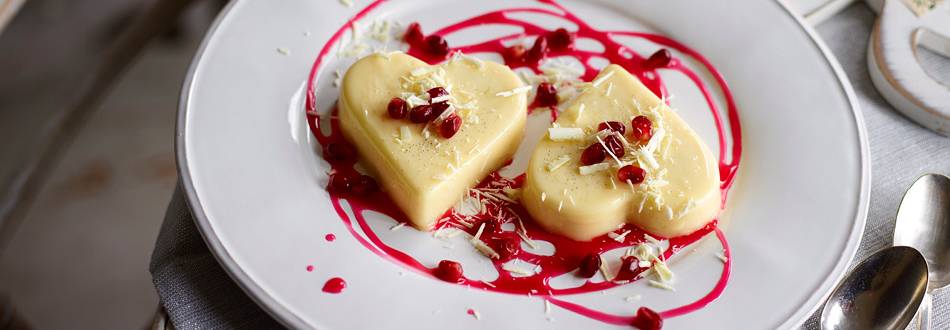 Cream lime heart with a pomegranate sauce